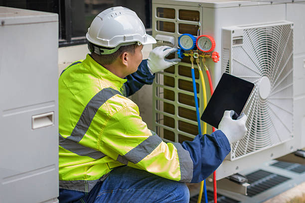Professional Air Conditioning Repair technician working in Holly, MI